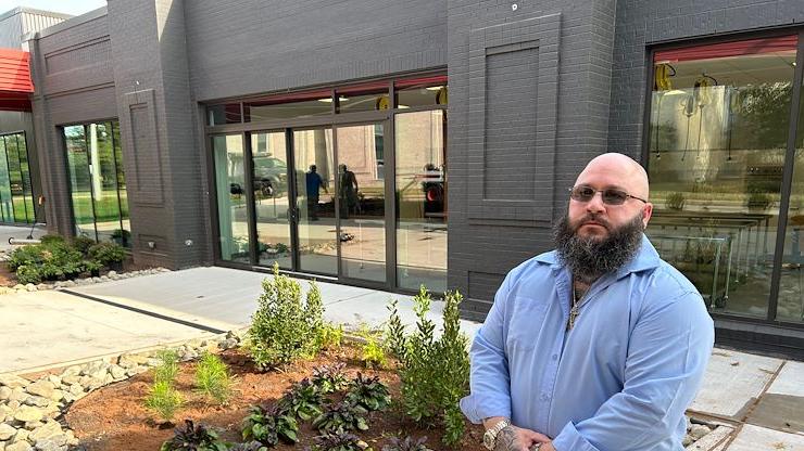 Culinary Arts major Christopher MacWilliams stands in front of the new Hospitality Institute on the Blue Bell Campus that will open soon. MacWilliams recently was named the recipient of the Paul Decker & Valley Forge Tourism & Convention Board Hospitality Scholarship. Photo by Eric Devlin